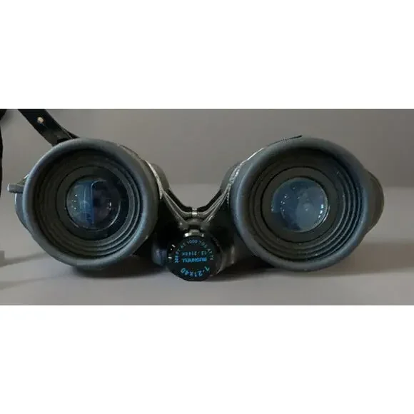 BUSHNELL 13–2140 K, 288ft @ 1000 YDS @ 7X POWER ZOOM BINOCULAR W/Carrying Bag